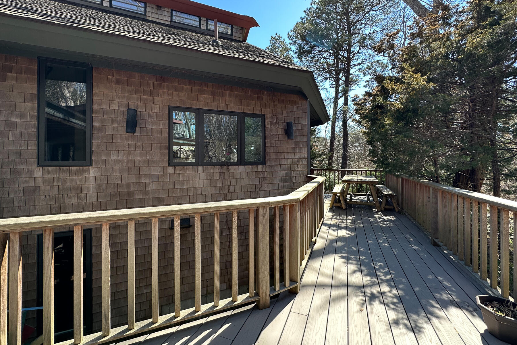 506 Old Chequessett Neck Road Wellfleet, MA 02667 - Photo 16 of 46 a view of a wooden house with a large window