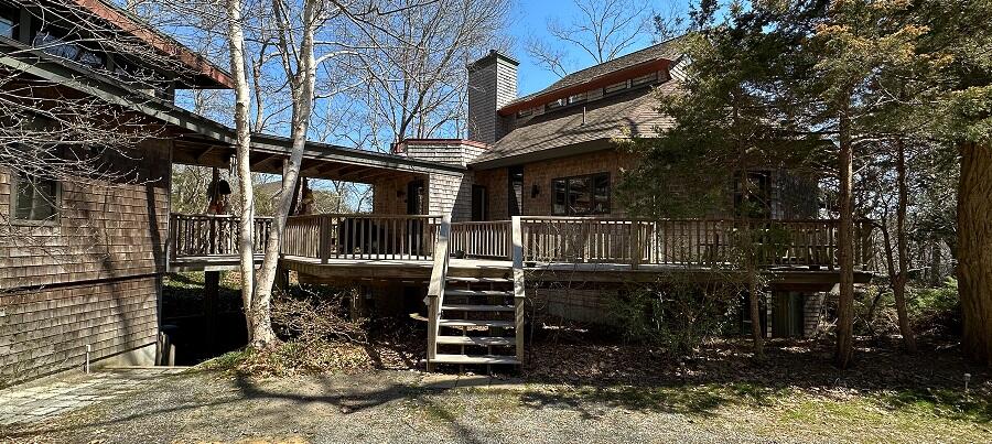 506 Old Chequessett Neck Road Wellfleet, MA 02667 - Photo 2 of 46 a view of a house with a yard