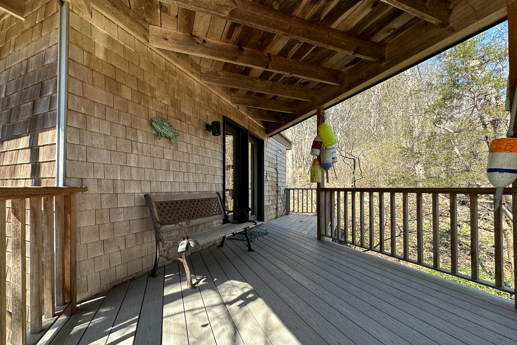 506 Old Chequessett Neck Road Wellfleet, MA 02667 - Photo 33 of 46 a view of a porch with wooden floor