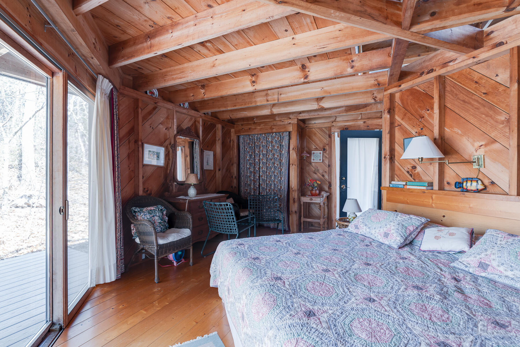 506 Old Chequessett Neck Road Wellfleet, MA 02667 - Photo 36 of 46 a bedroom with a bed and a mirror