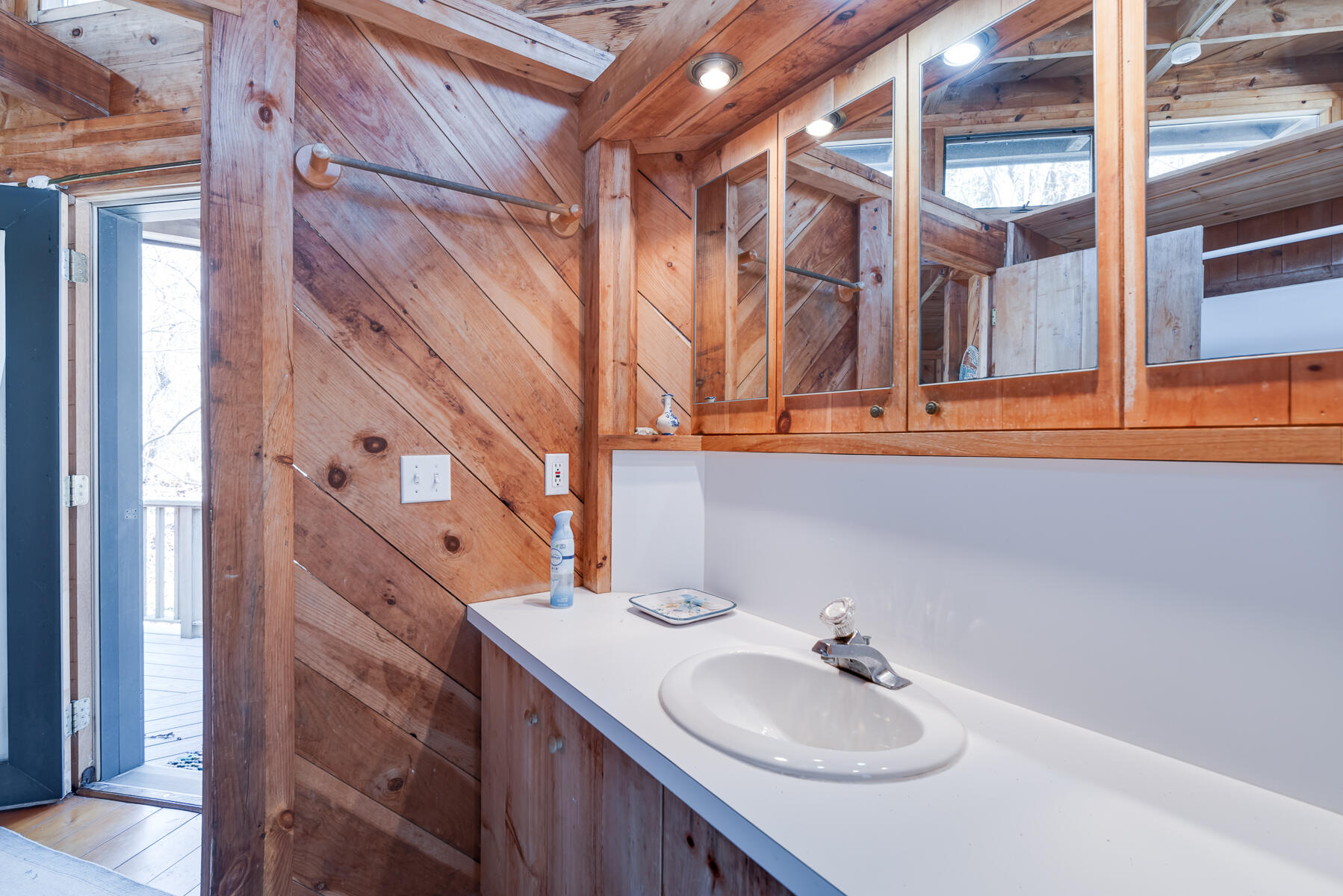 506 Old Chequessett Neck Road Wellfleet, MA 02667 - Photo 39 of 46 a bathroom with a sink and a mirror