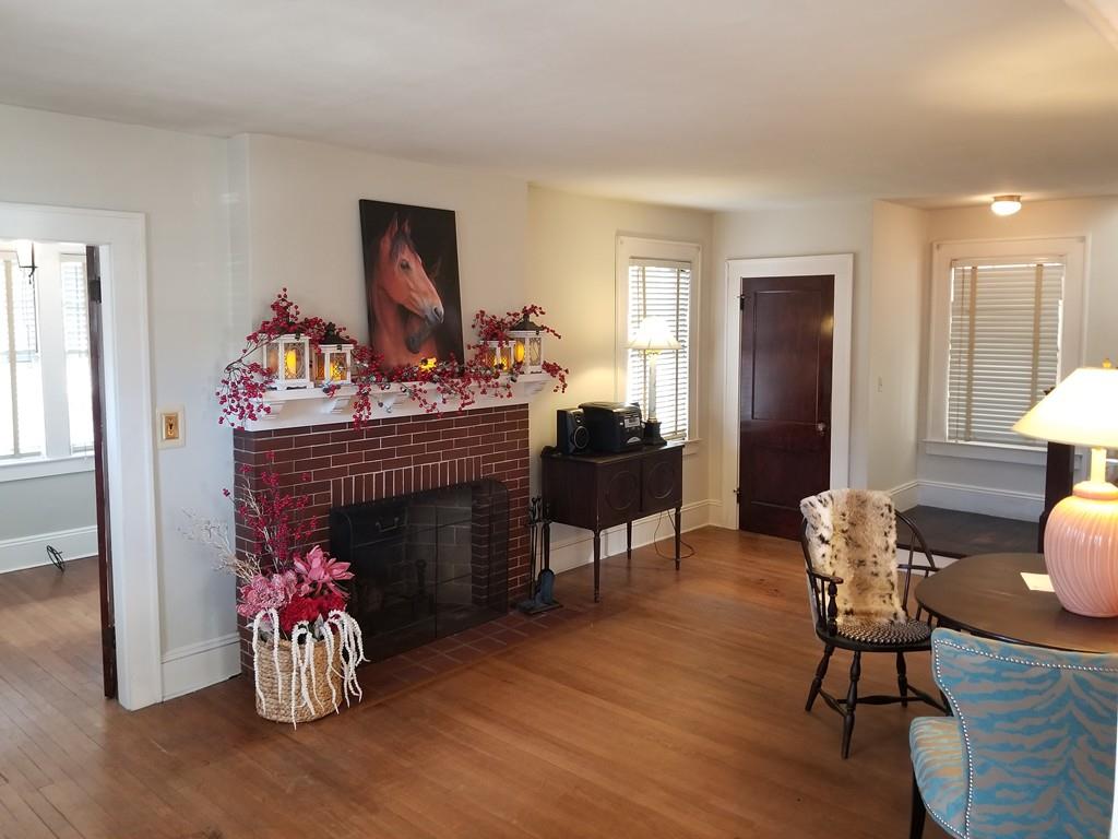 51 Reed Street Agawam, MA 01001 - Photo 2 of 14 a living room with furniture and a fireplace