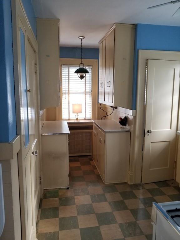 51 Reed Street Agawam, MA 01001 - Photo 8 of 14 a room with a refrigerator and a window