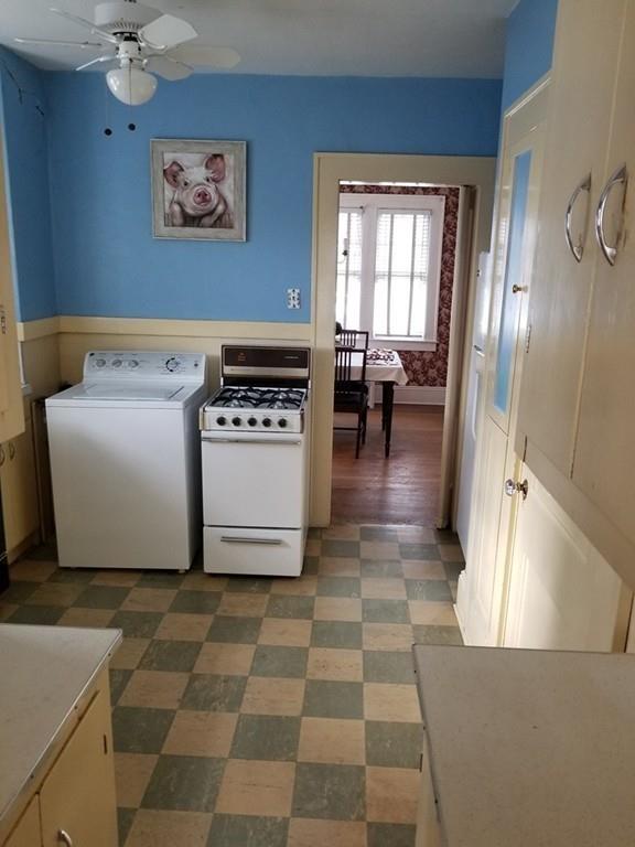 51 Reed Street Agawam, MA 01001 - Photo 9 of 14 a kitchen with a stove a refrigerator and cabinets