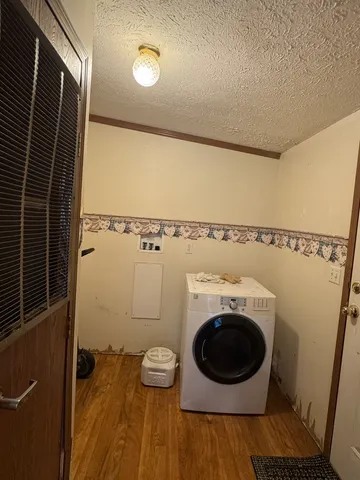 a view of a storage & utility room with a washer dryer