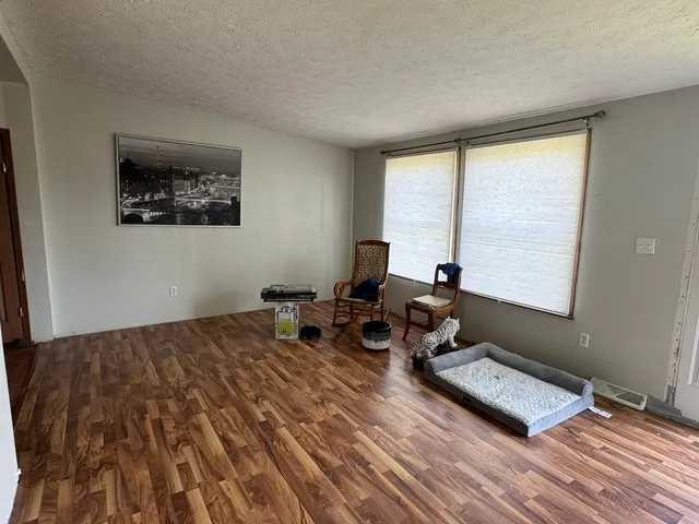 a bed room with a bed and a window