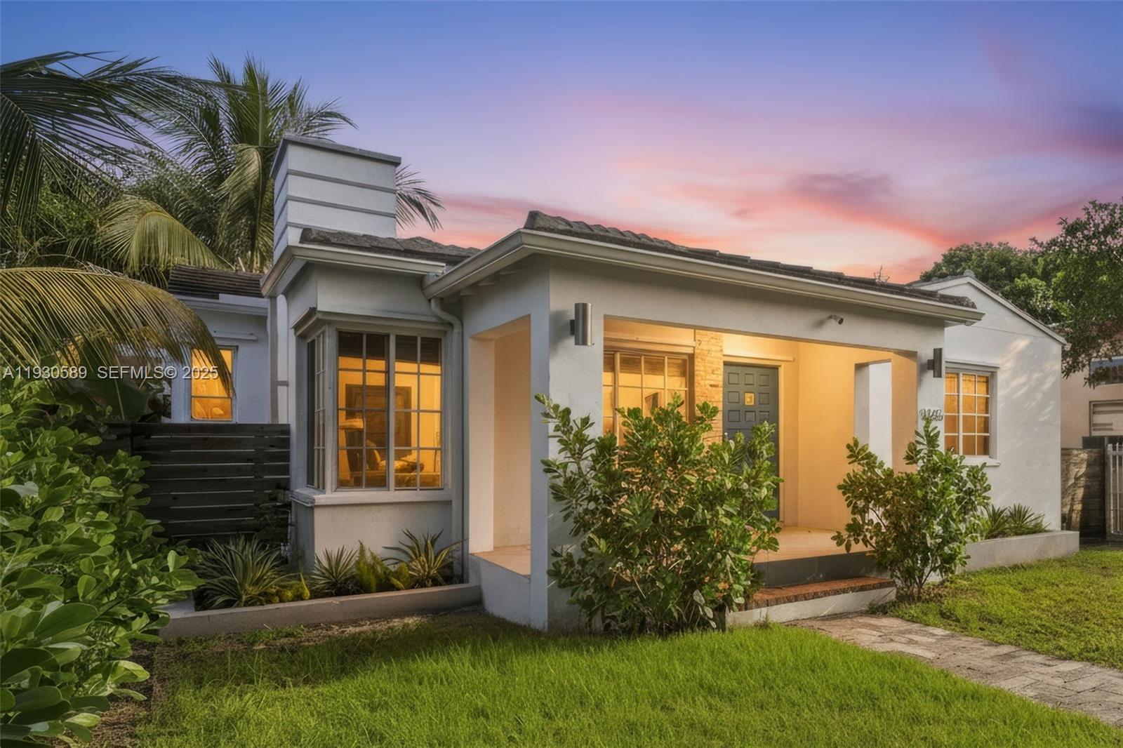 555 Northeast 73rd Street Miami, FL 33138 - Photo 1 of 32 a front view of a house with garden