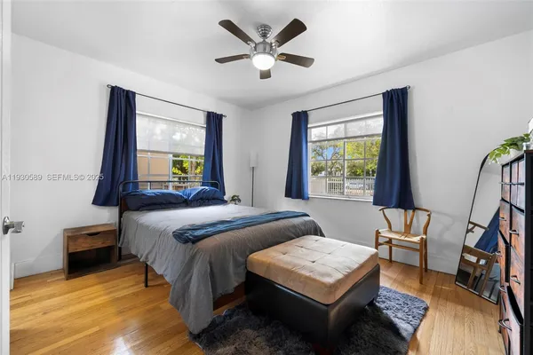 a bedroom with a bed and a table in it