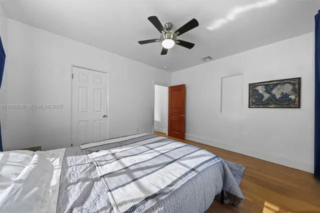 a bedroom with bed and a window