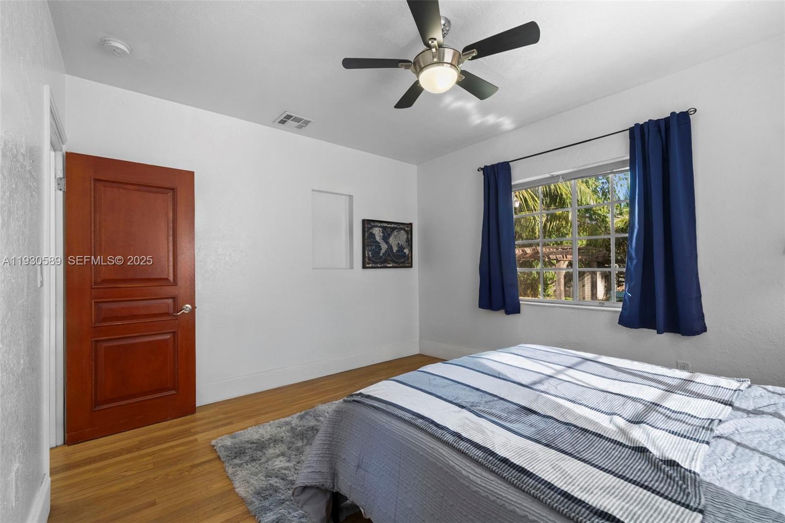 555 Northeast 73rd Street Miami, FL 33138 - Photo 18 of 32 a bedroom with bed and a window