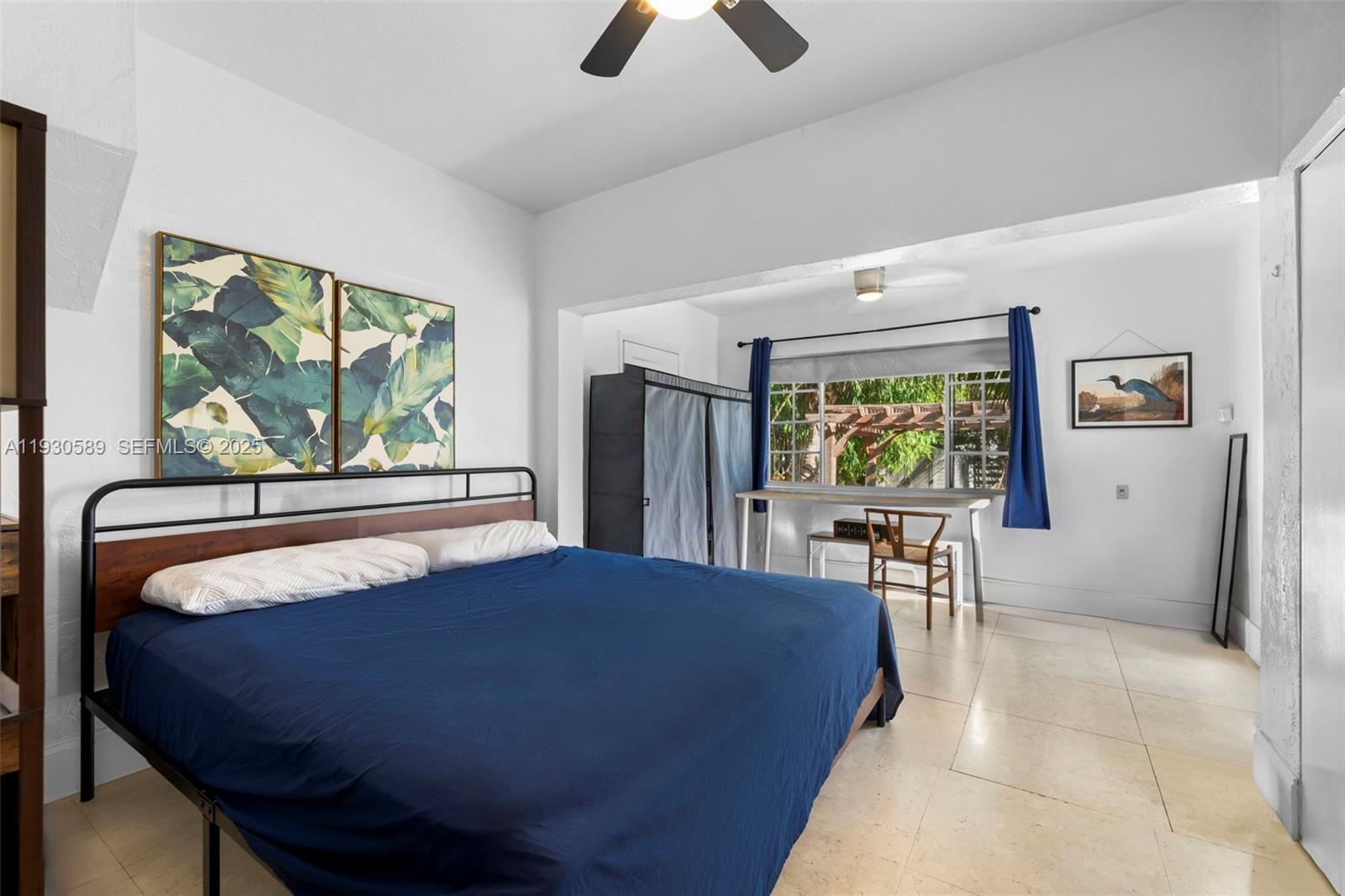 555 Northeast 73rd Street Miami, FL 33138 - Photo 20 of 32 a bed sitting in a bedroom next to a window