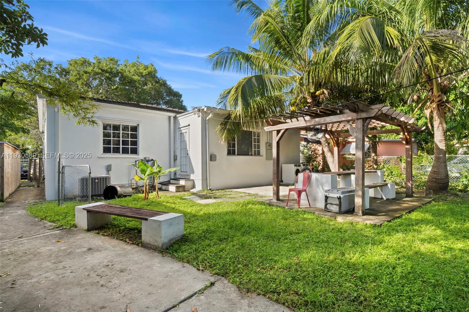 555 Northeast 73rd Street Miami, FL 33138 - Photo 23 of 32 a view of a backyard with couches and plants