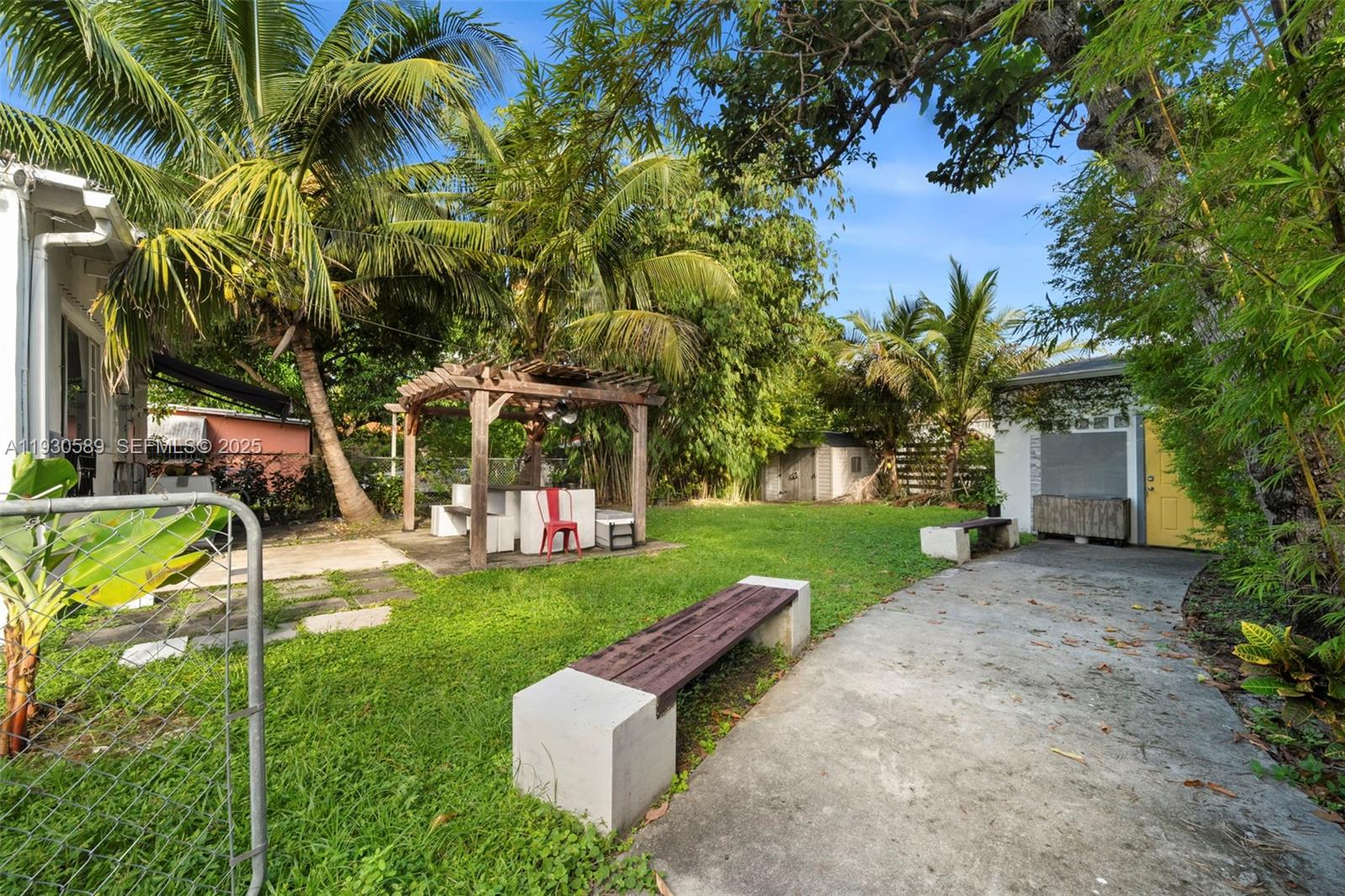 555 Northeast 73rd Street Miami, FL 33138 - Photo 27 of 32 a view of a chair and table in the garden