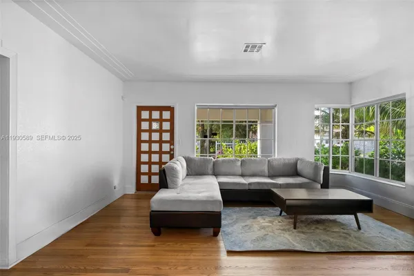 a living room with furniture and a window