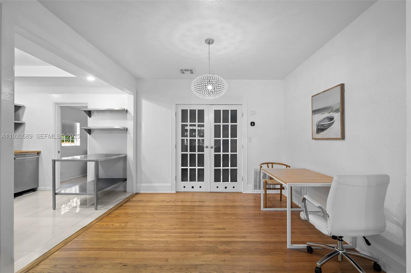 555 Northeast 73rd Street Miami, FL 33138 - Photo 5 of 32 a view of a workspace with furniture and windows