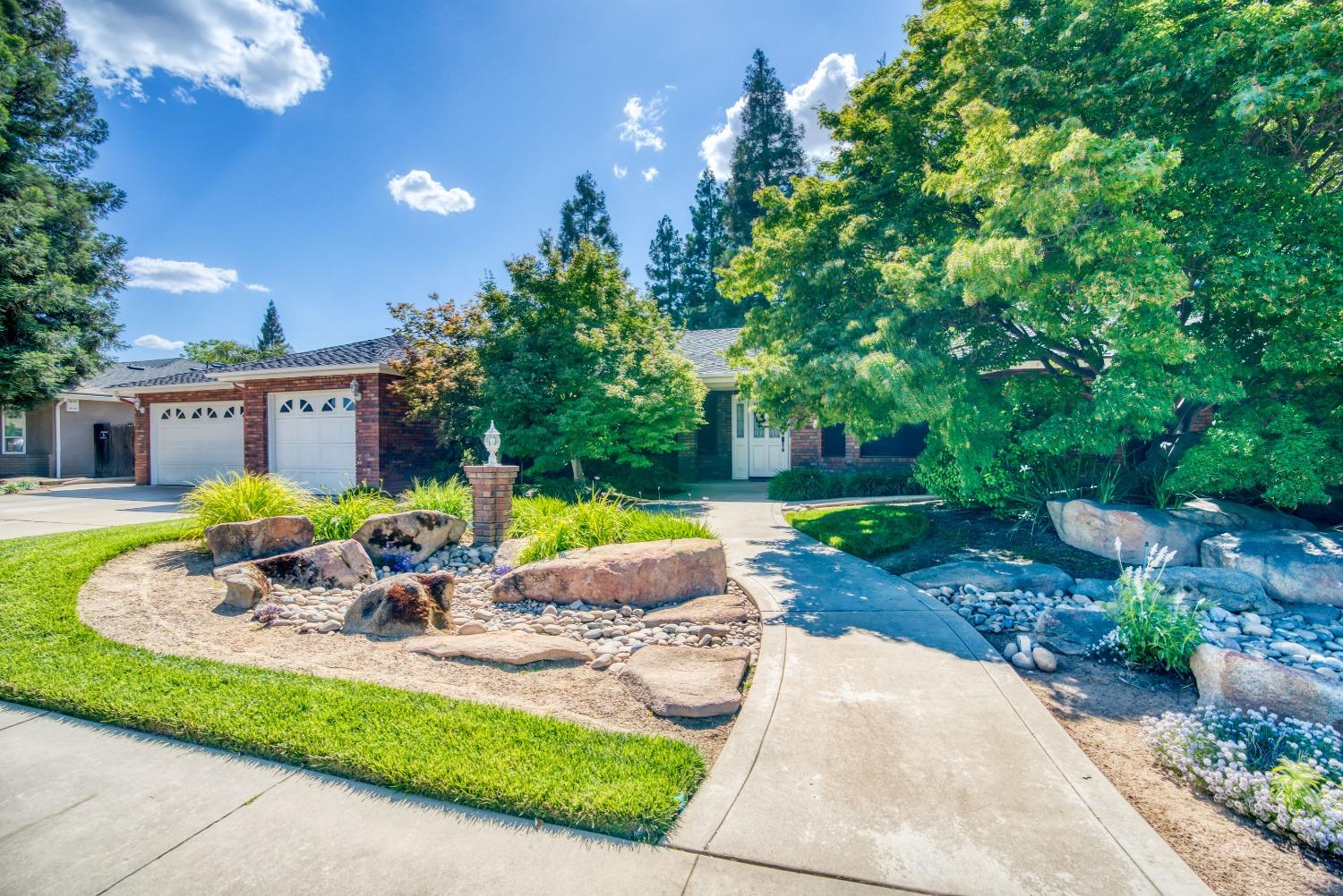 a front view of a house with swimming pool and porch