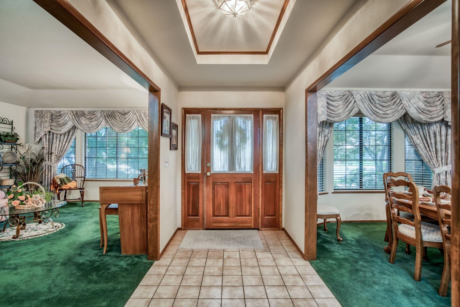77 Post Avenue Sanger, CA 93657 - Photo 12 of 62 a view of a porch with furniture and garden