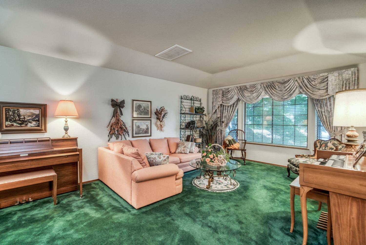 77 Post Avenue Sanger, CA 93657 - Photo 13 of 62 a living room with furniture and a large window
