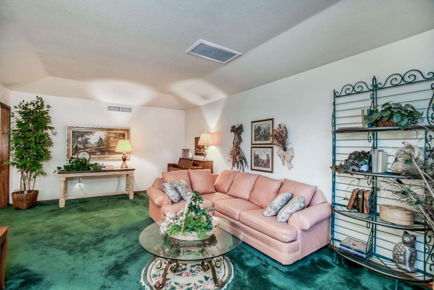 77 Post Avenue Sanger, CA 93657 - Photo 17 of 62 a living room with furniture and a large window
