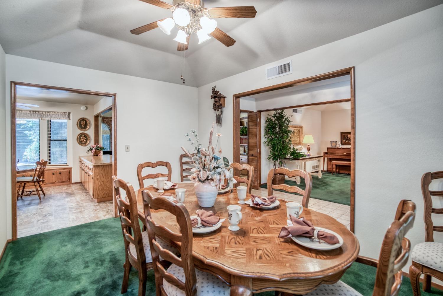 77 Post Avenue Sanger, CA 93657 - Photo 18 of 62 a view of a dining room with furniture wooden floor and chandelier