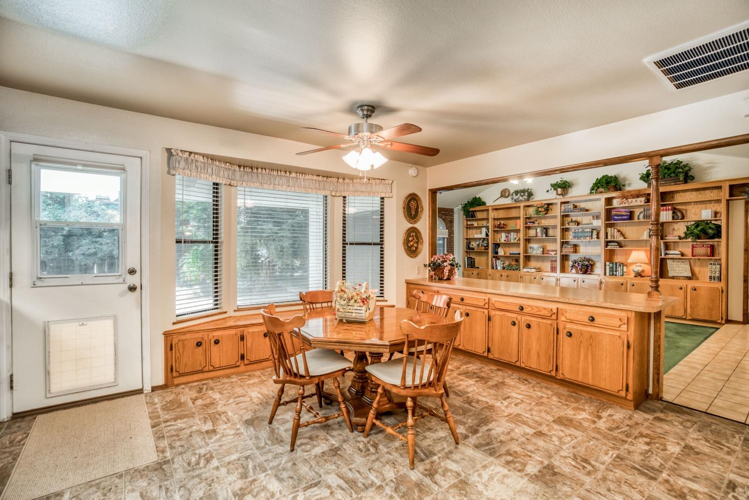 77 Post Avenue Sanger, CA 93657 - Photo 23 of 62 a view of a large dining room with furniture window and outside view