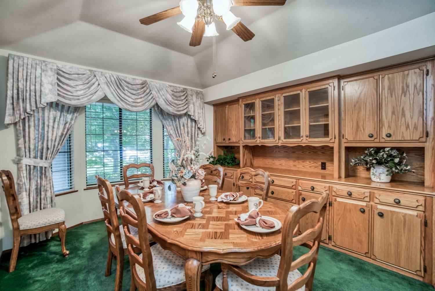 77 Post Avenue Sanger, CA 93657 - Photo 3 of 62 a view of a dining room with furniture window and outside view