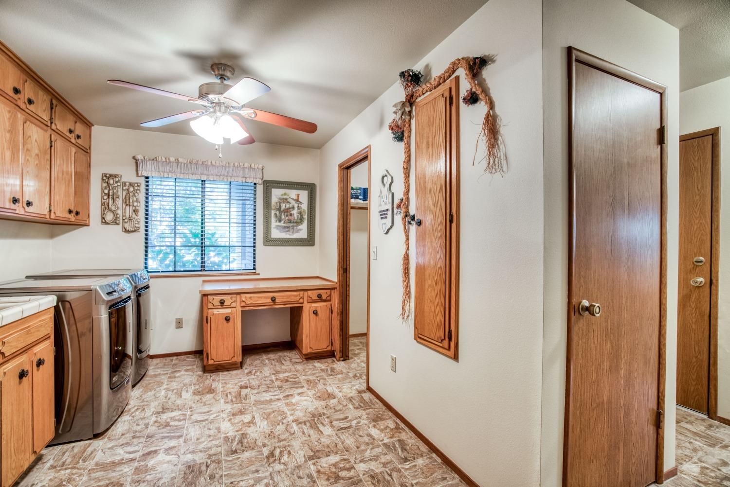 77 Post Avenue Sanger, CA 93657 - Photo 34 of 62 a large white kitchen with a stove a sink dishwasher a refrigerator and a stove top oven