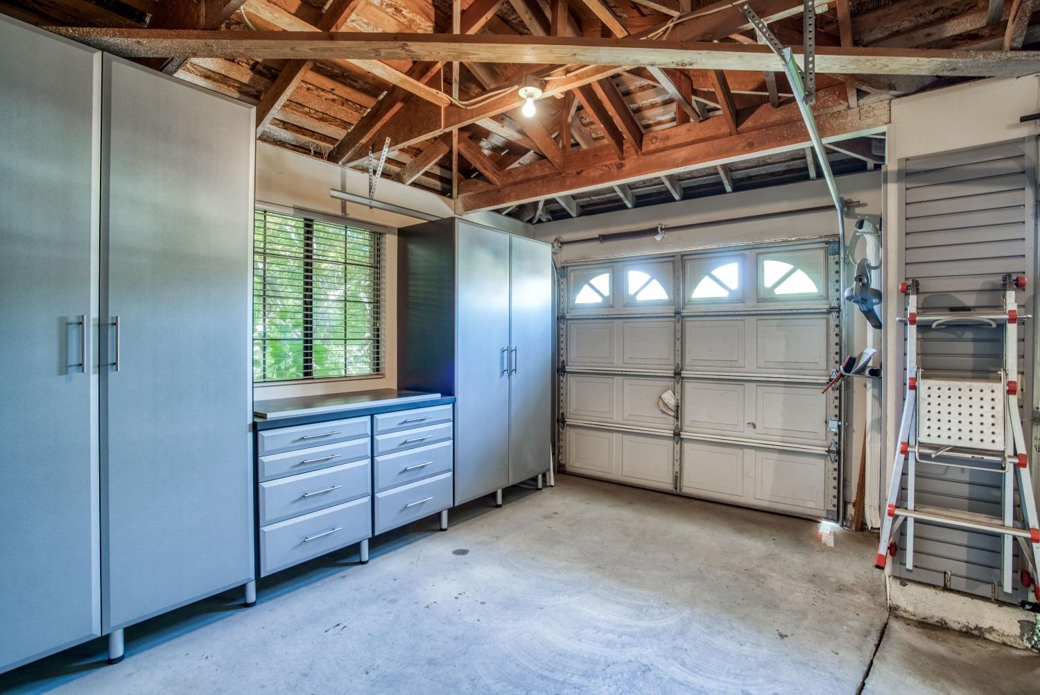 77 Post Avenue Sanger, CA 93657 - Photo 36 of 62 a view of an empty room with cabinet