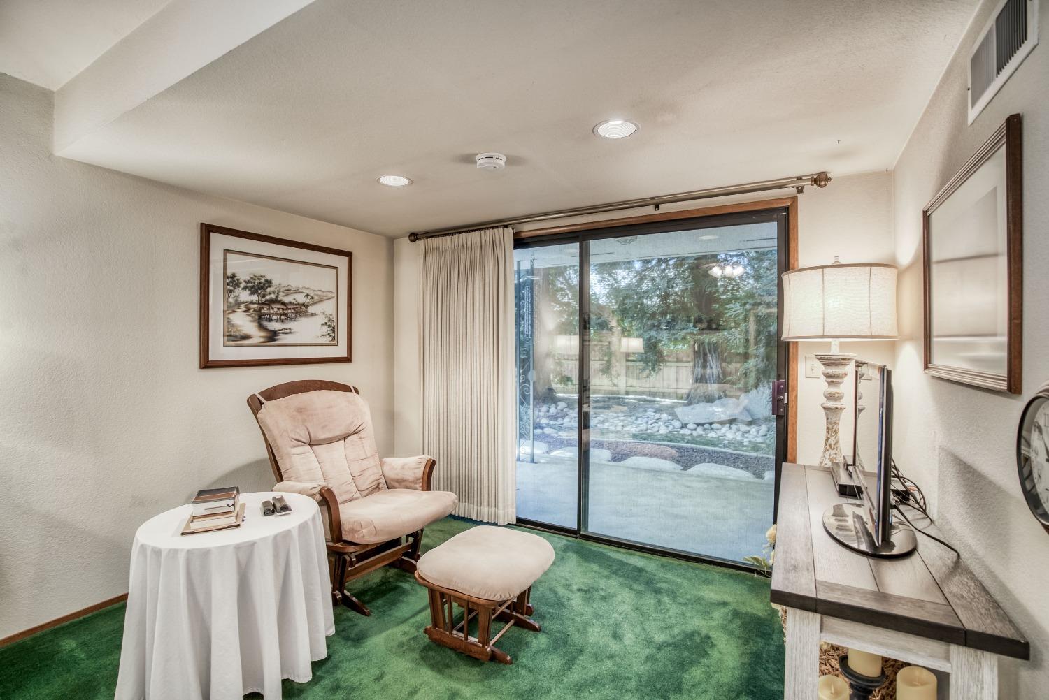 77 Post Avenue Sanger, CA 93657 - Photo 44 of 62 a living room with furniture a rug and a toilet