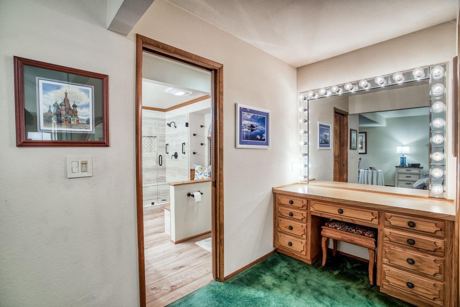 77 Post Avenue Sanger, CA 93657 - Photo 45 of 62 a view of a hallway with a cabinet and a mirror