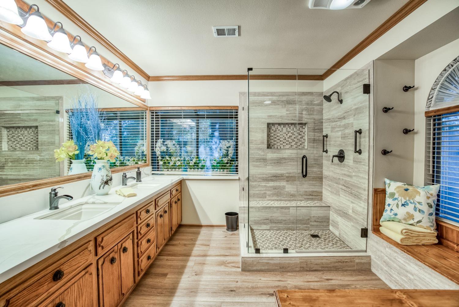77 Post Avenue Sanger, CA 93657 - Photo 46 of 62 a bathroom with double vanity sink and a shower