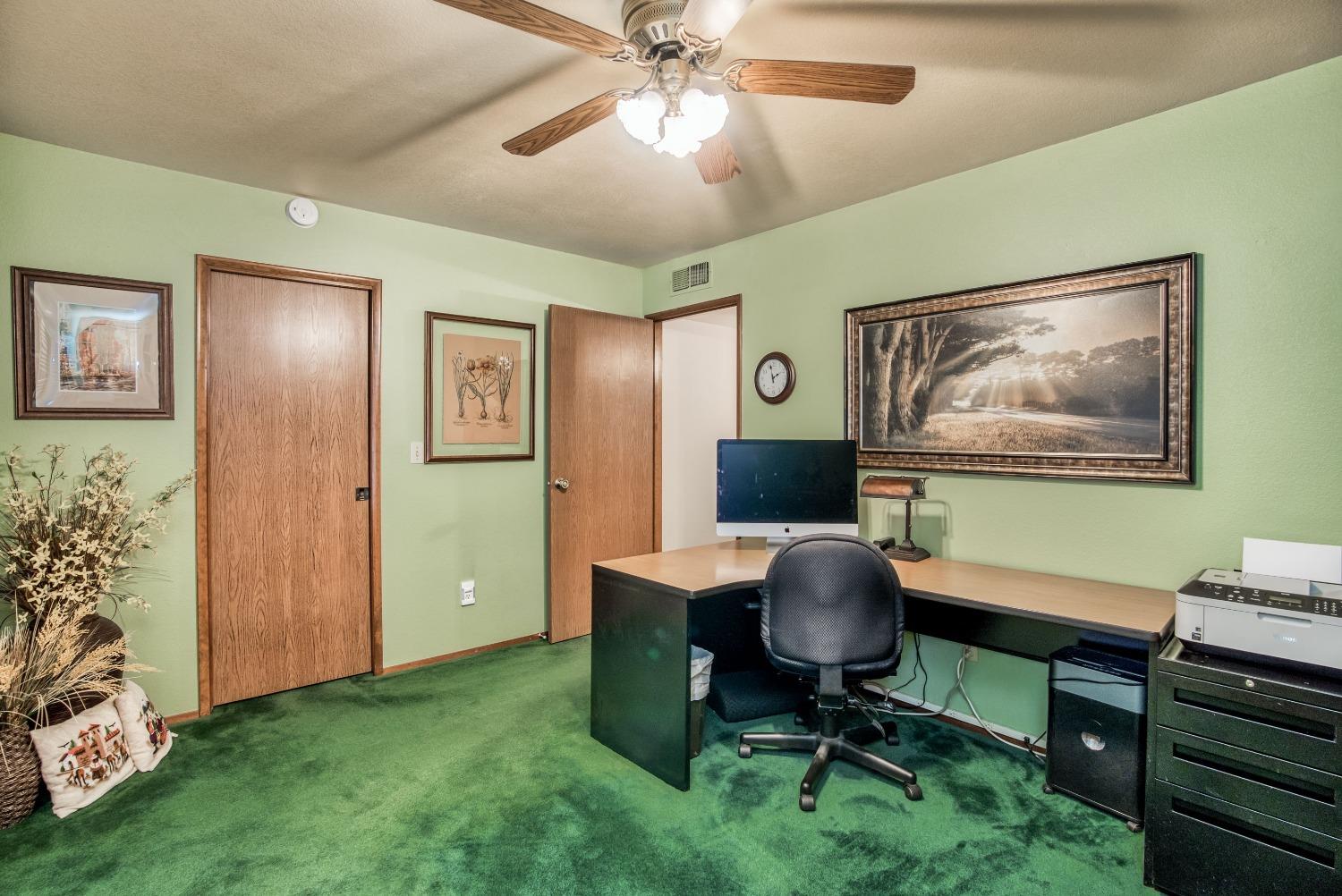 77 Post Avenue Sanger, CA 93657 - Photo 49 of 62 a view of a workspace with furniture and a window