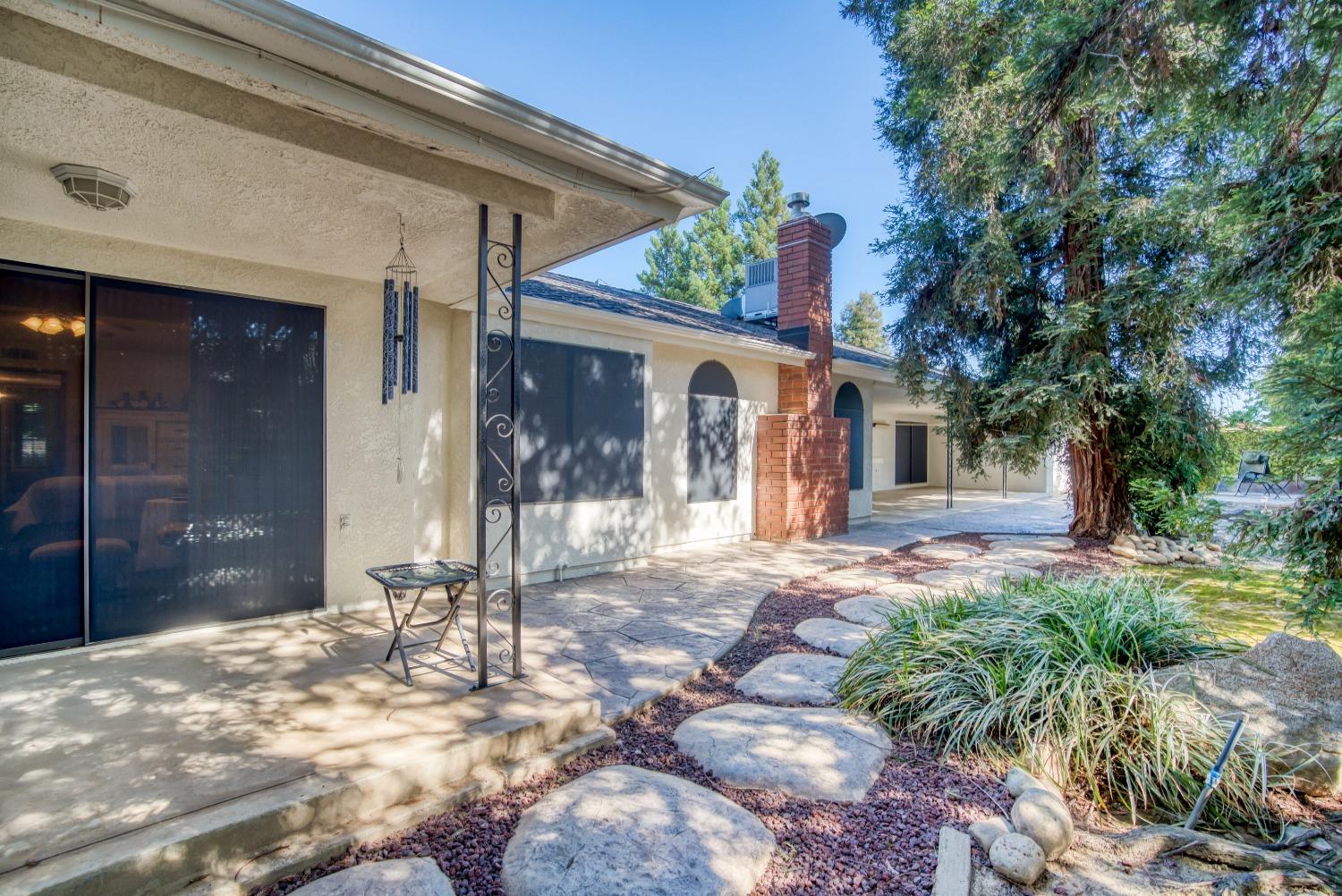 77 Post Avenue Sanger, CA 93657 - Photo 60 of 62 a view of a house with a yard
