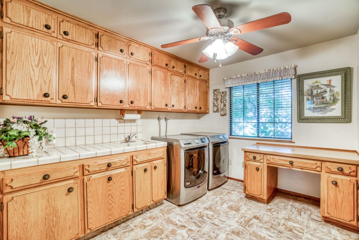 77 Post Avenue Sanger, CA 93657 - Photo 6 of 62 a kitchen with stainless steel appliances sink cabinets and window