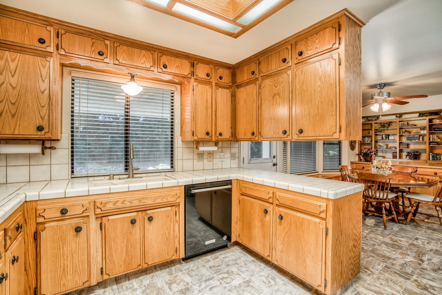 77 Post Avenue Sanger, CA 93657 - Photo 10 of 62 a kitchen with a sink stove and cabinets