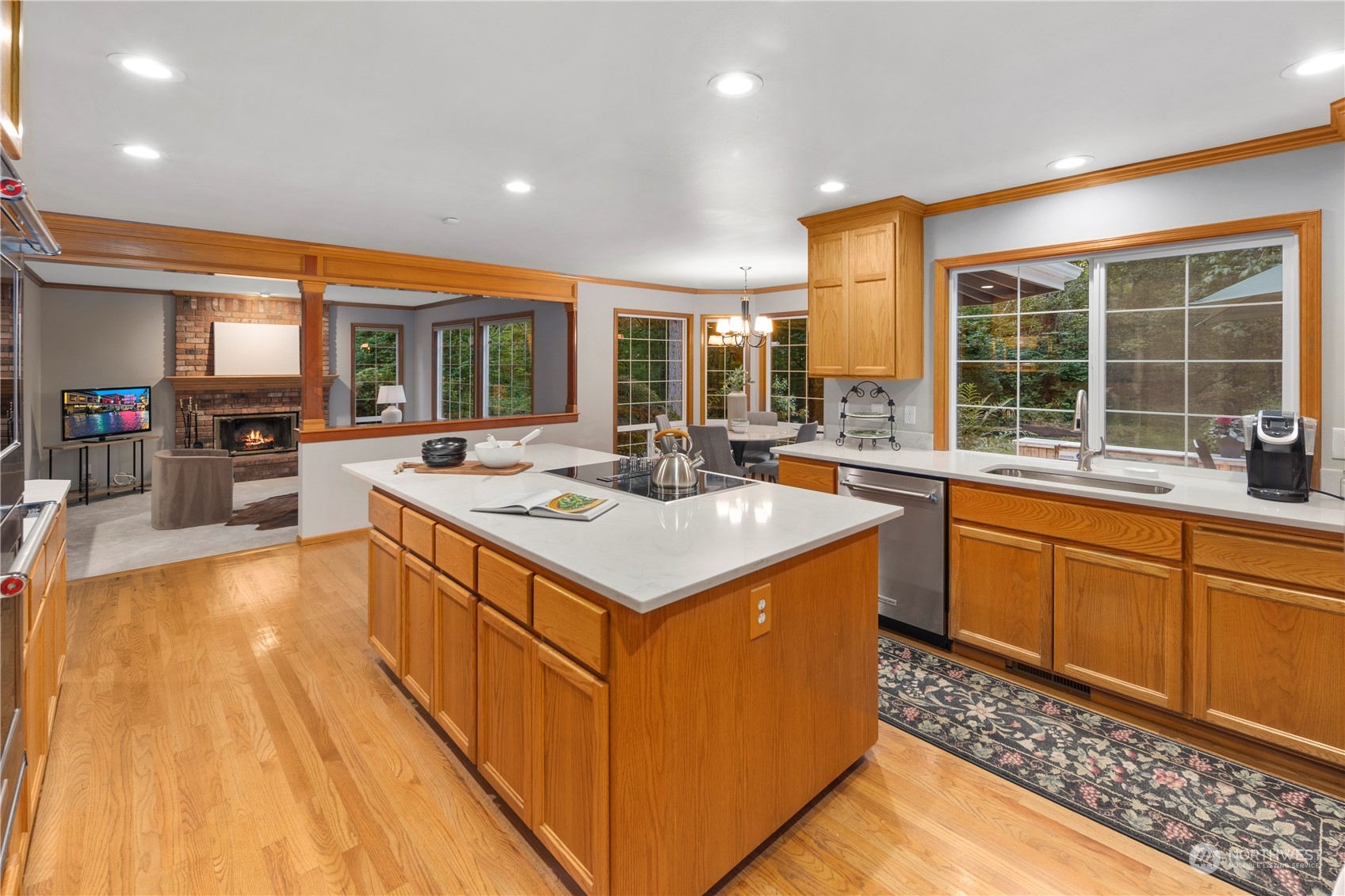5381 242nd Place Northeast Redmond, WA 98053 - Photo 13 of 40 a kitchen with stainless steel appliances granite countertop a sink and a stove