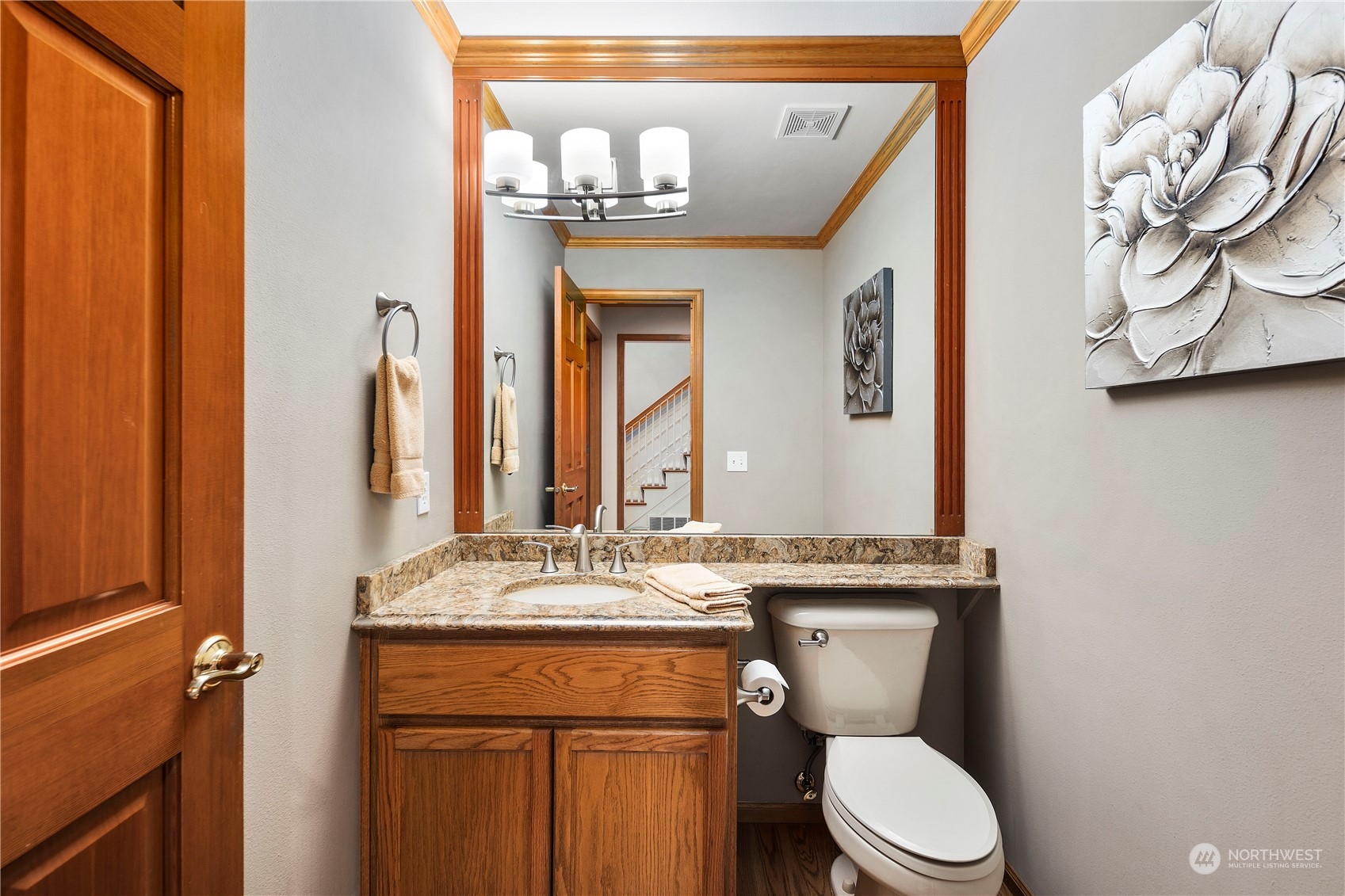 5381 242nd Place Northeast Redmond, WA 98053 - Photo 16 of 40 a bathroom with a granite countertop toilet sink and mirror