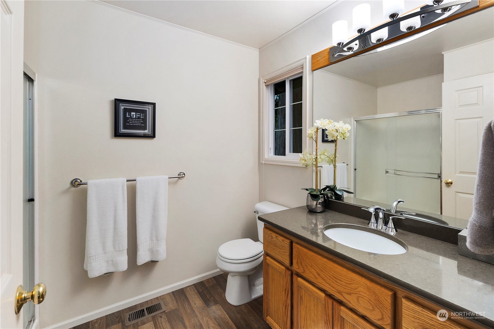 5381 242nd Place Northeast Redmond, WA 98053 - Photo 18 of 40 a bathroom with a granite countertop sink toilet and a mirror