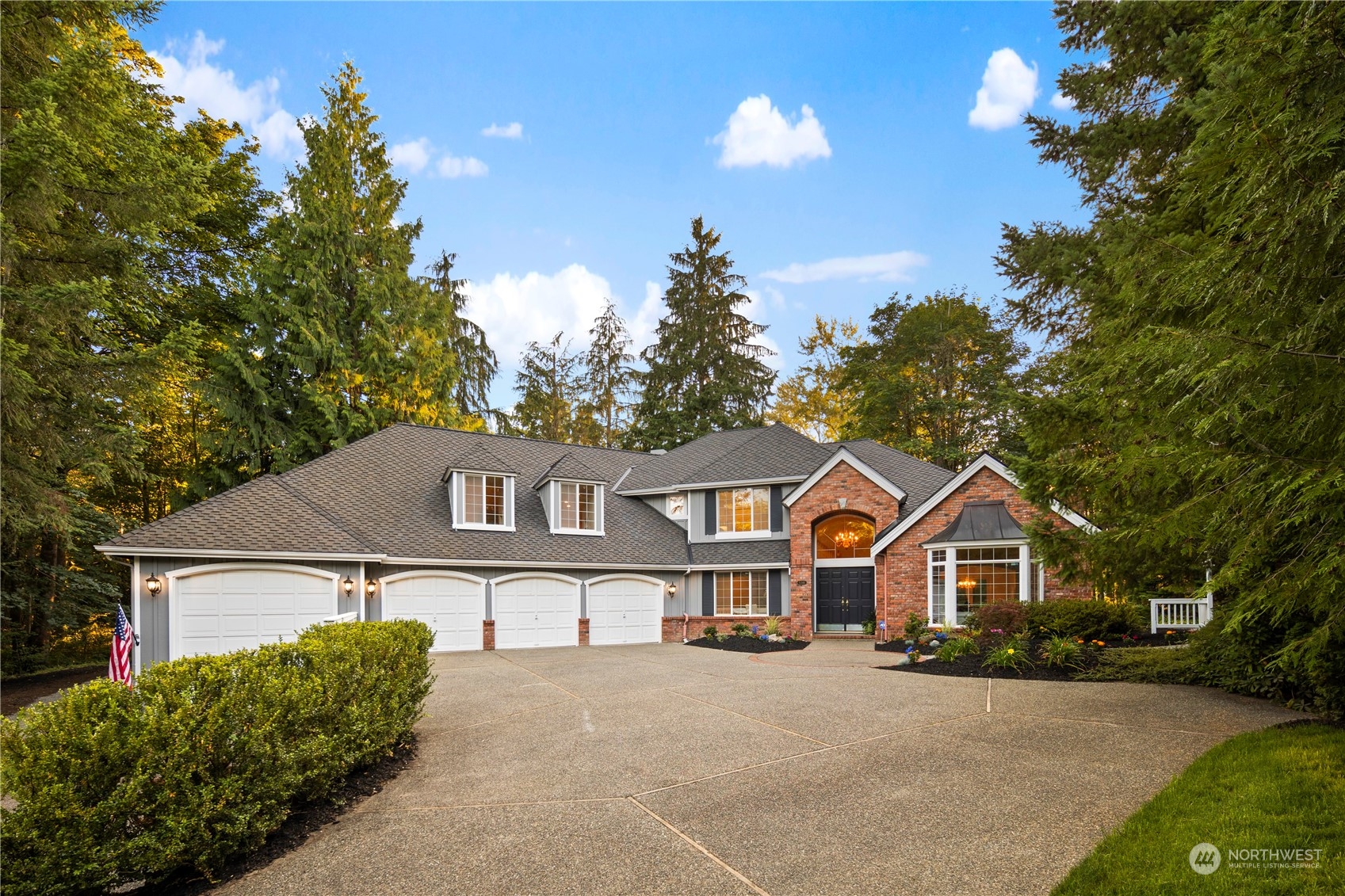 5381 242nd Place Northeast Redmond, WA 98053 - Photo 2 of 40 a front view of a house with a yard and garage