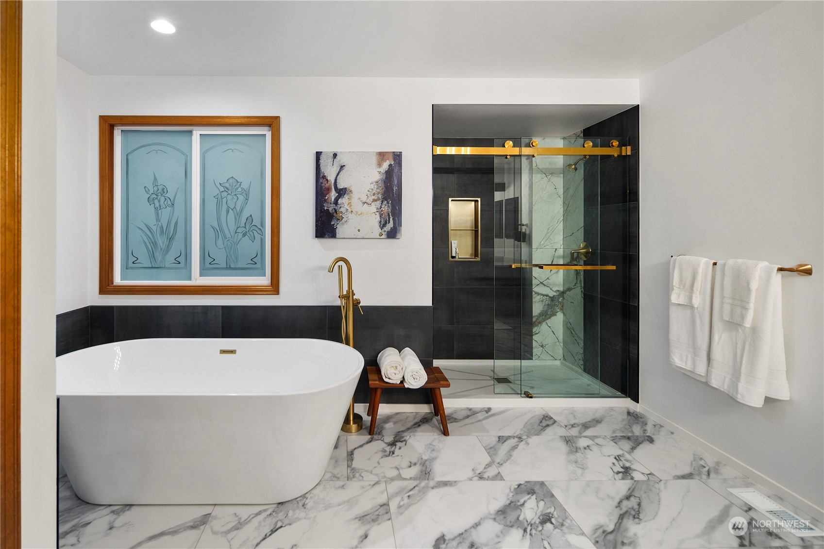 5381 242nd Place Northeast Redmond, WA 98053 - Photo 22 of 40 a bathroom with a bathtub and a shower