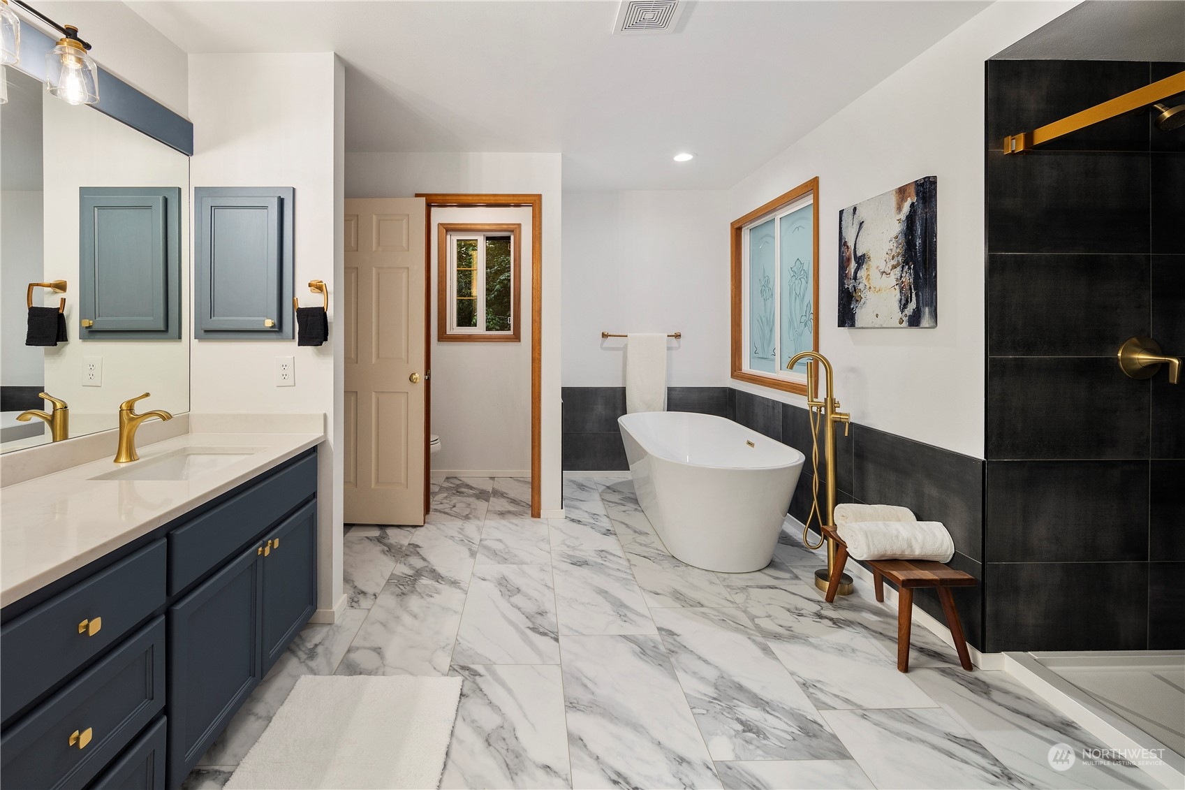 5381 242nd Place Northeast Redmond, WA 98053 - Photo 24 of 40 a bathroom with a toilet sink and mirror