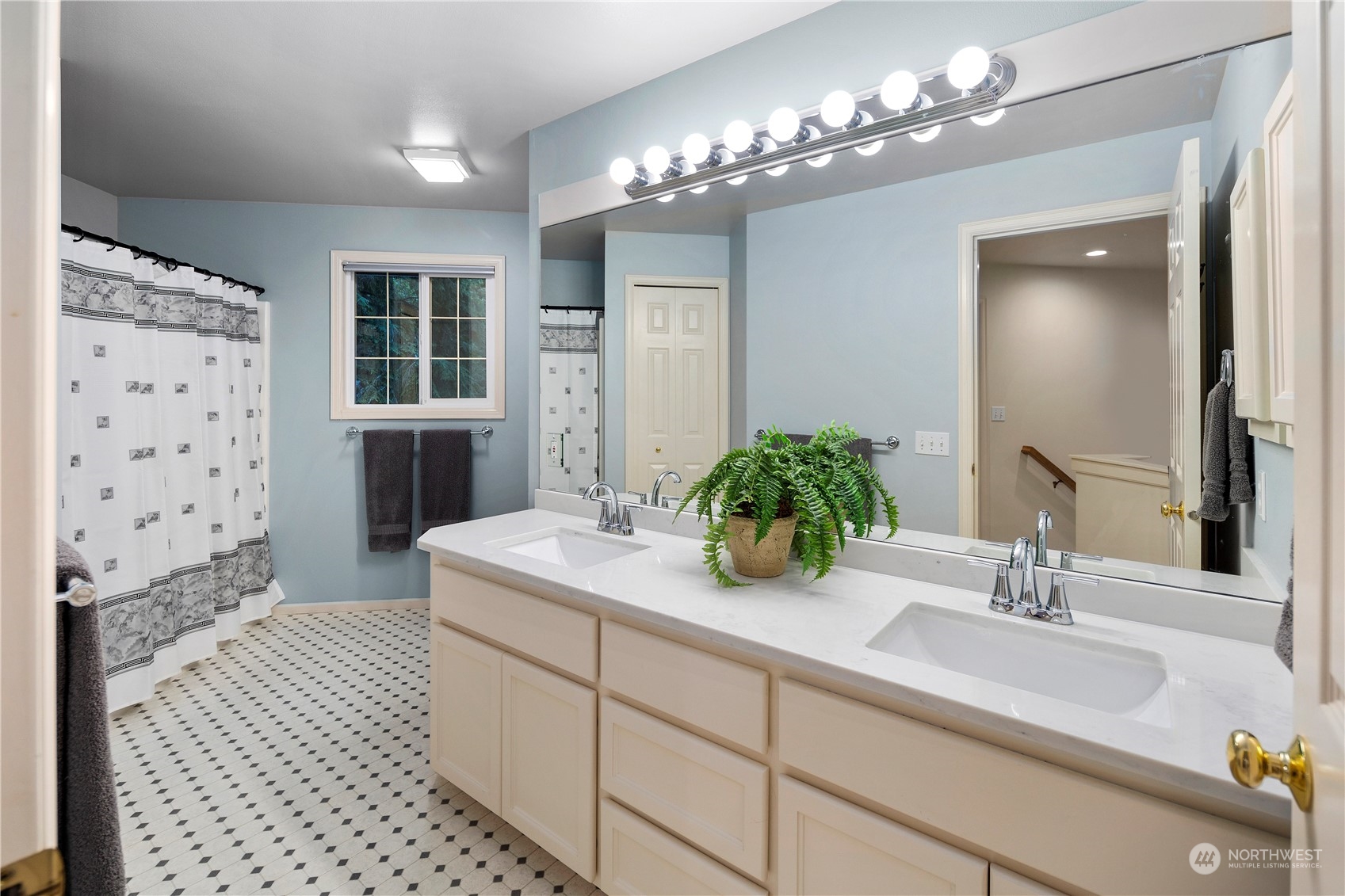 5381 242nd Place Northeast Redmond, WA 98053 - Photo 26 of 40 a bathroom with a sink a double vanity and a shower