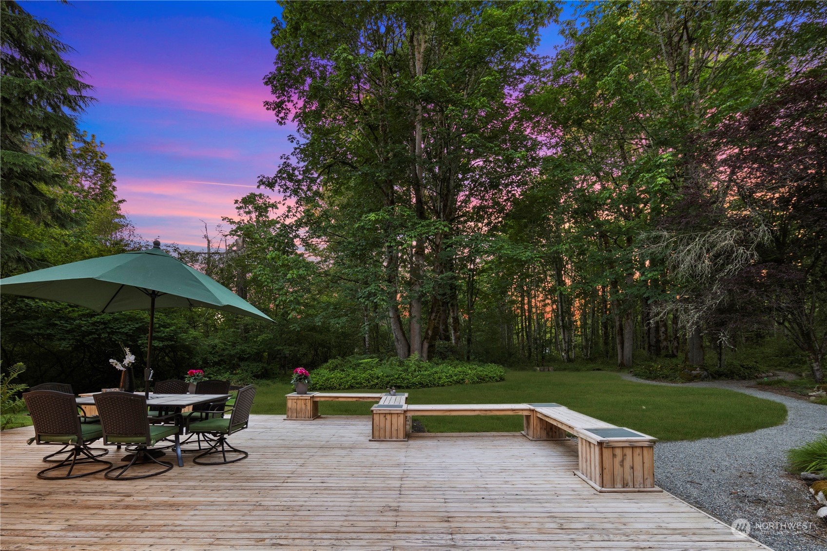 5381 242nd Place Northeast Redmond, WA 98053 - Photo 32 of 40 an outdoor sitting area with furniture and umbrella
