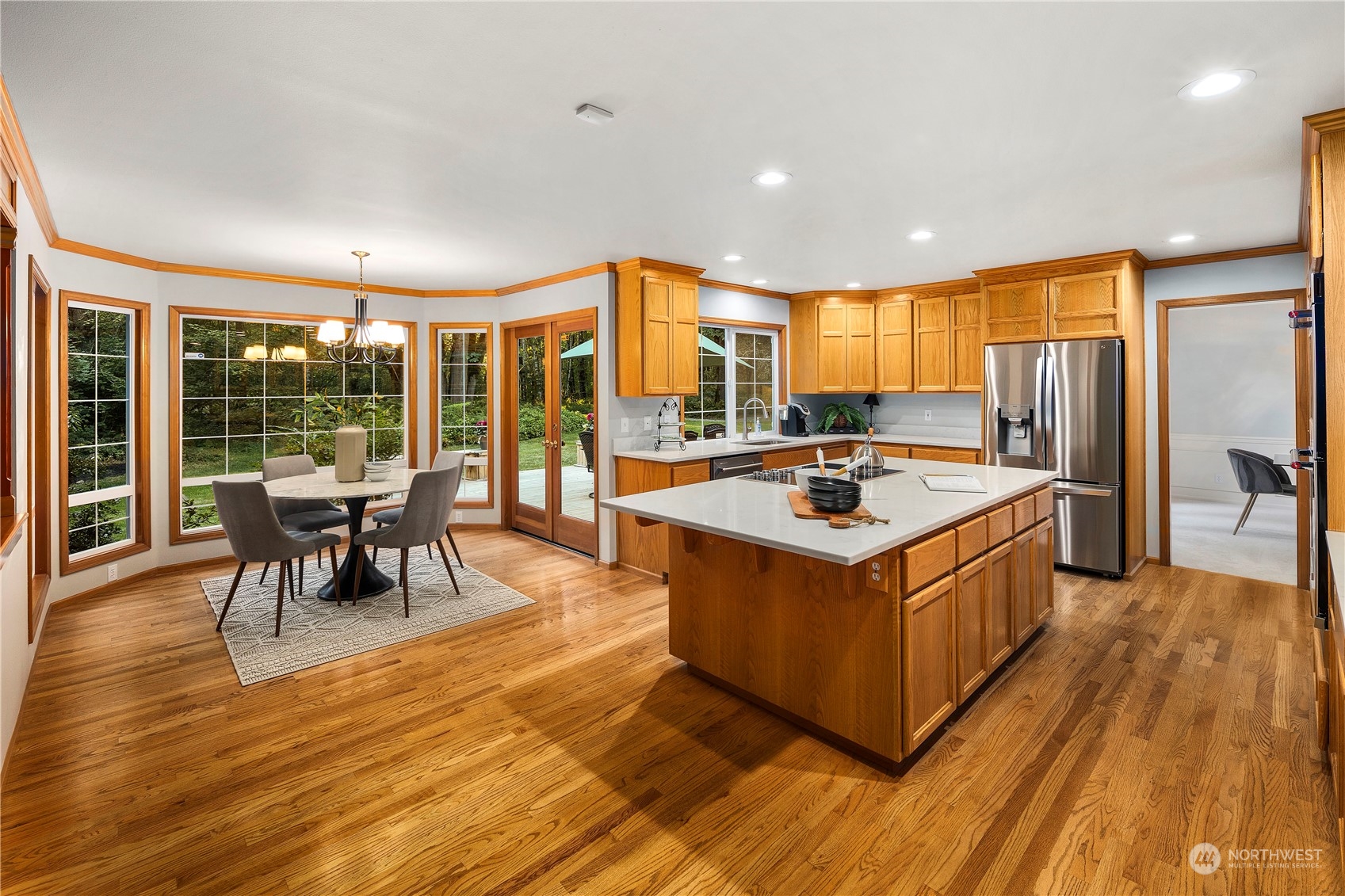 5381 242nd Place Northeast Redmond, WA 98053 - Photo 9 of 40 a kitchen with stainless steel appliances granite countertop a stove and a refrigerator