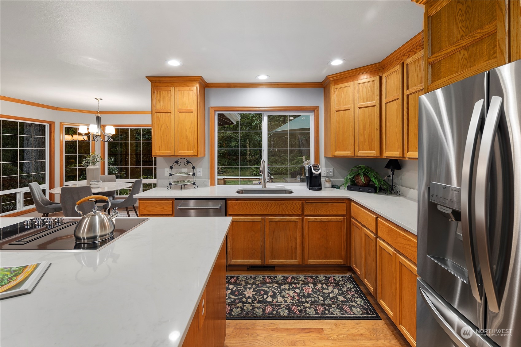 5381 242nd Place Northeast Redmond, WA 98053 - Photo 10 of 40 a large kitchen with a large window and stainless steel appliances