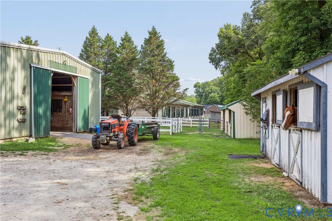 2016 Forge Road Toano, VA 23168 - Photo 8 of 99 Equestrian facility featuring a white horse barn w