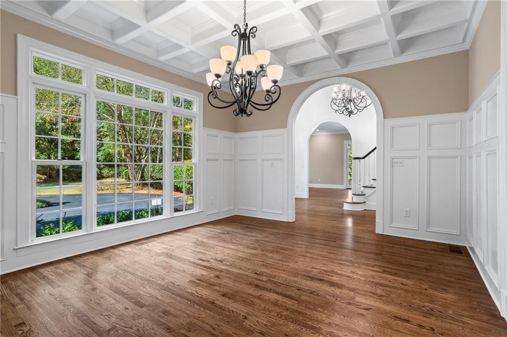 1235 West Garmon Road Northwest Atlanta, GA 30327 - Photo 12 of 46 a view of an empty room with wooden floor and a window