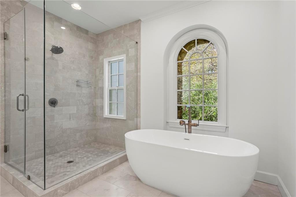 1235 West Garmon Road Northwest Atlanta, GA 30327 - Photo 23 of 46 a white bath tub sitting next to a window