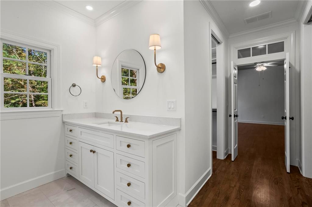 1235 West Garmon Road Northwest Atlanta, GA 30327 - Photo 25 of 46 a bathroom with a double vanity sink and a mirror
