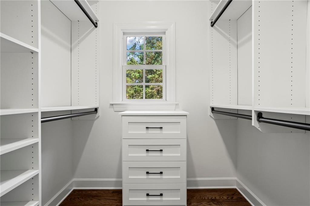 1235 West Garmon Road Northwest Atlanta, GA 30327 - Photo 26 of 46 a view of walk in closet with clothes and shoes
